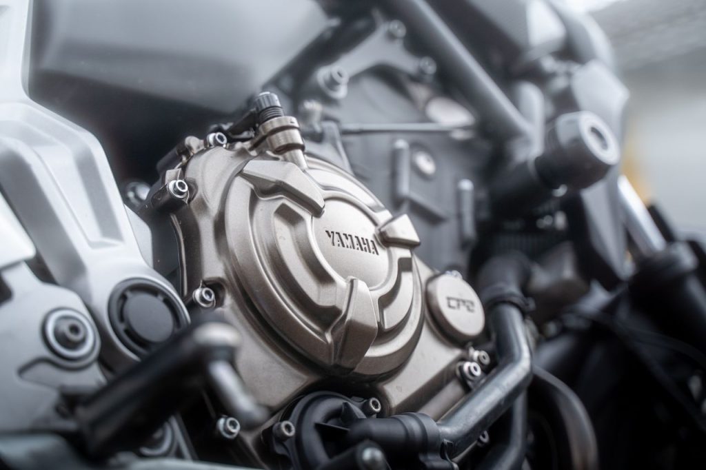Detailed view of a Yamaha motorcycle engine, emphasizing mechanical components.